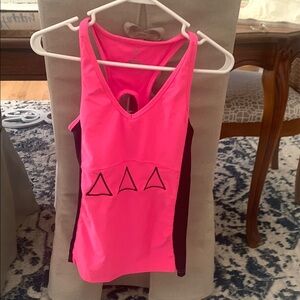 Tri delta bright pink and black workout top
With little on the back!